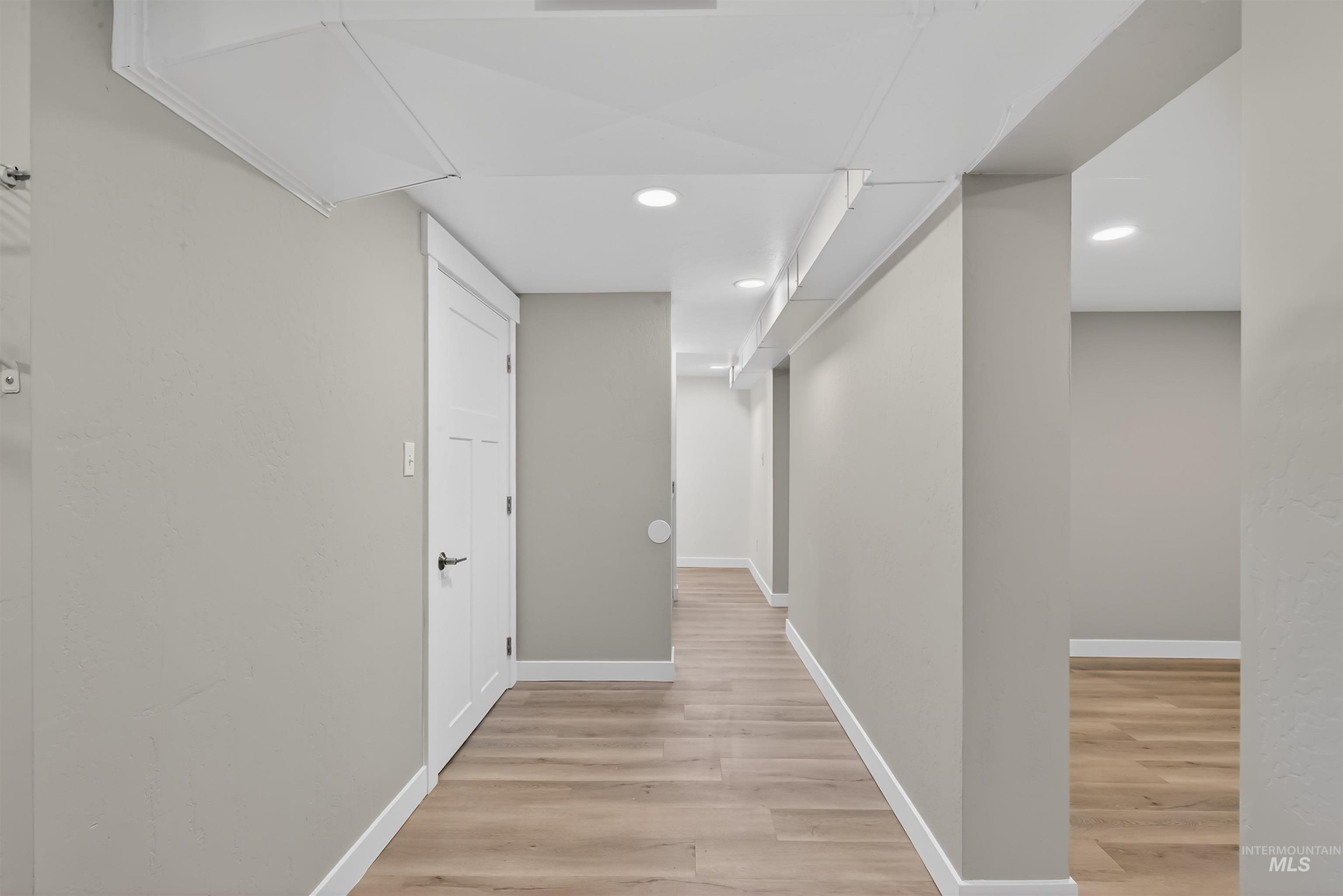 929 10th Street Clarkston, WA 99403 - Photo 27 of 43 Hallway with light wood finished floors and recessed lighting