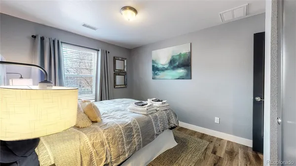 a bedroom with a bed and a dresser