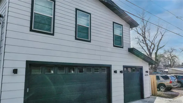 a front view of a house with parking