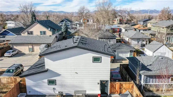 a view of a house with a yard and balcony