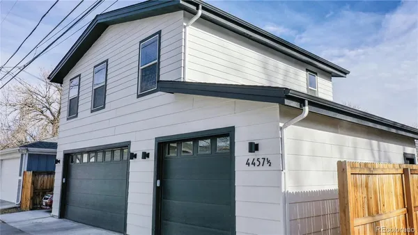 a front view of a house with garage