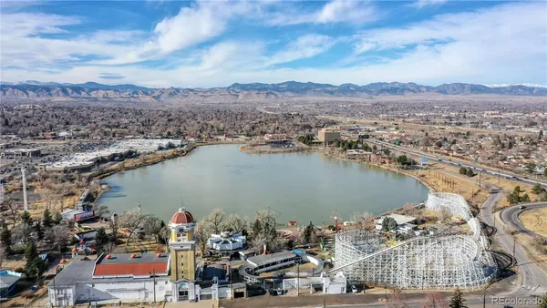 an aerial view of ocean and residential houses