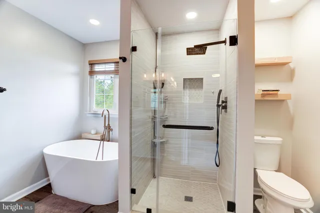 a bathroom with a bathtub and a shower