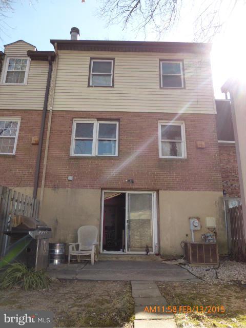 8270 Imperial Drive, Unit 5D Laurel, MD 20708 - Photo 2 of 5 a front view of a house with a yard