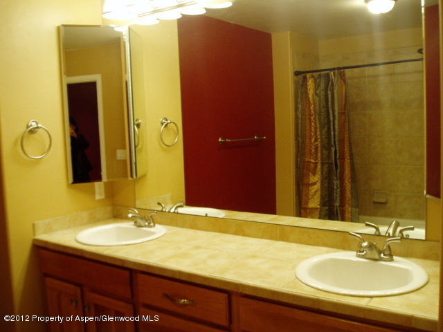 668 Alder Ridge Lane New Castle, CO 81647 - Photo 20 of 30 a bathroom with a sink and a mirror