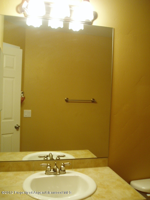 668 Alder Ridge Lane New Castle, CO 81647 - Photo 21 of 30 a bathroom with a sink and a mirror