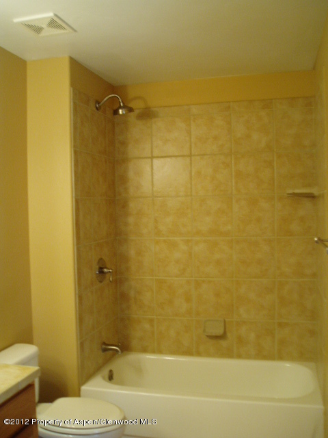 668 Alder Ridge Lane New Castle, CO 81647 - Photo 22 of 30 a bathroom with a sink and a shower