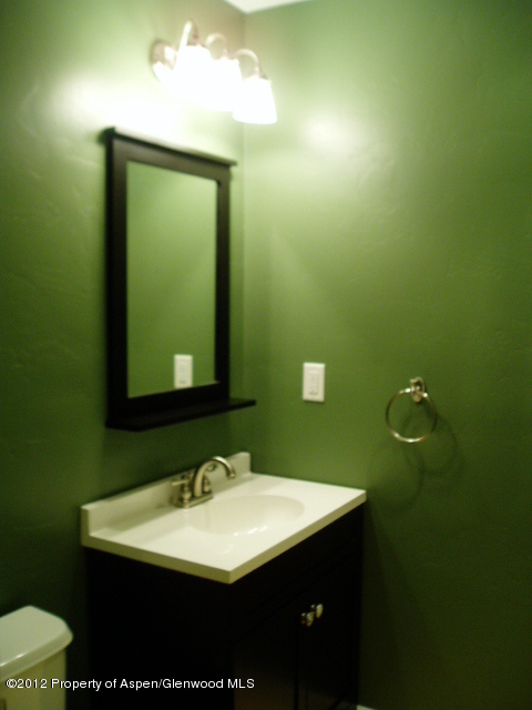 668 Alder Ridge Lane New Castle, CO 81647 - Photo 7 of 30 a bathroom with a sink and a mirror