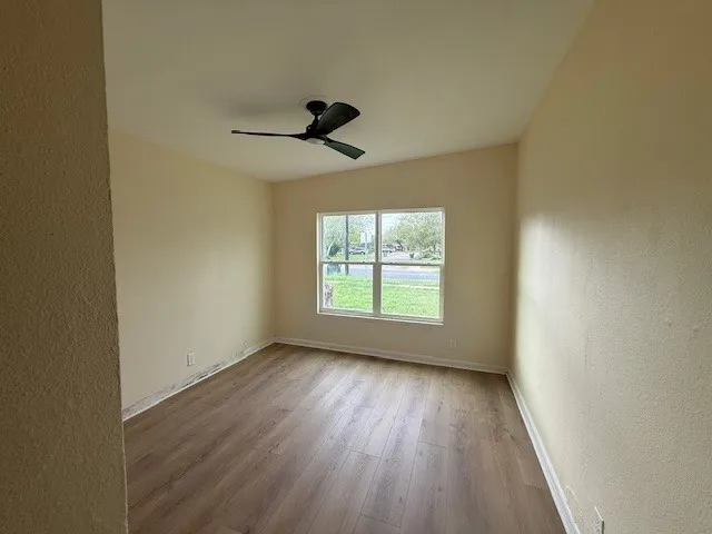 a view of room window and wooden floor