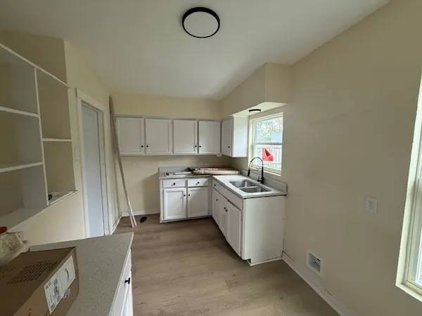 a kitchen with a stove and a refrigerator