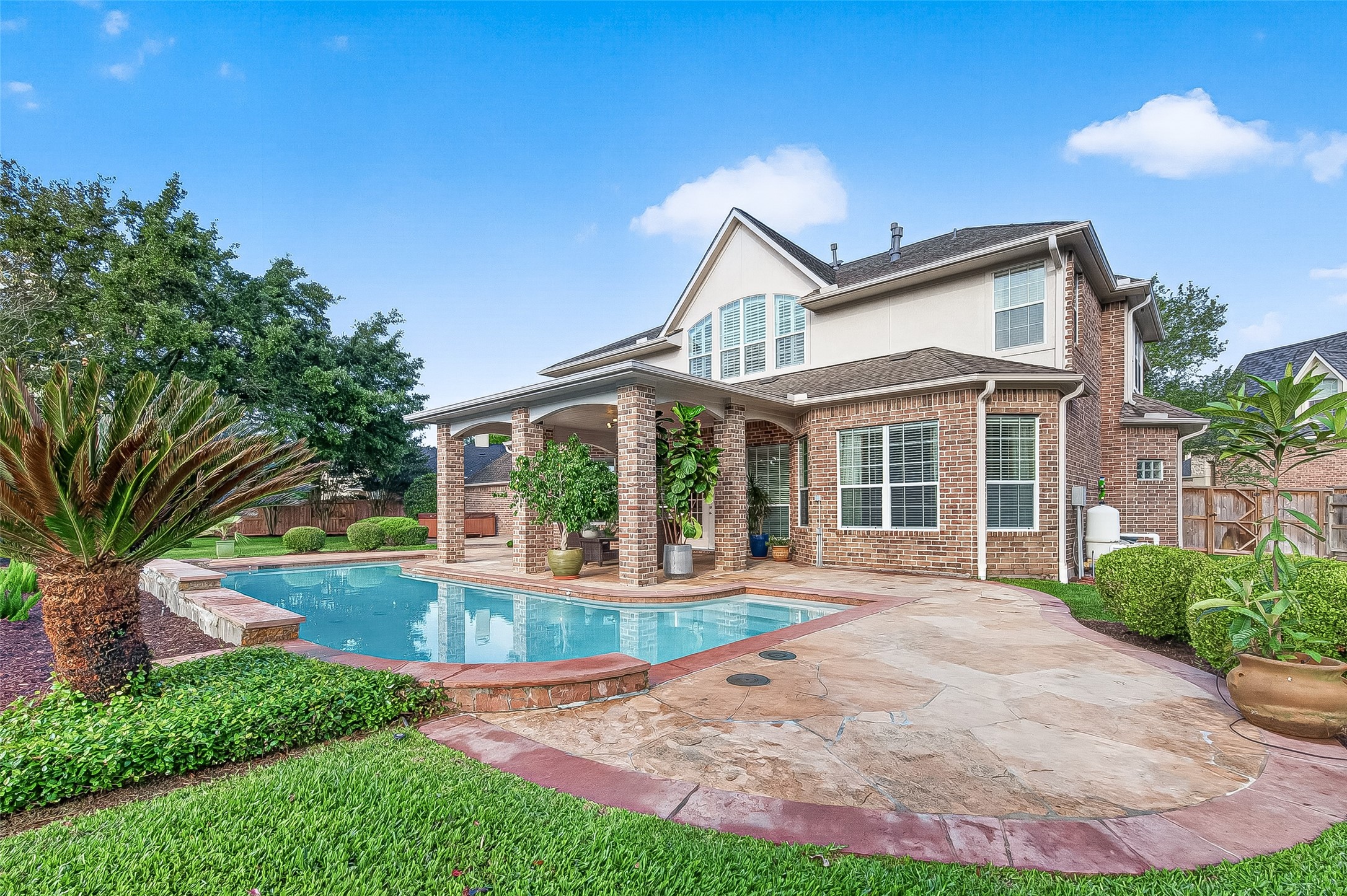4203 Deforest Ridge Circle Katy, TX 77494 - Photo 39 of 50 The backyard oasis features a sparkling pool, covered patio, a Hot Spring Vista spa while leaving plenty of green space to enjoy