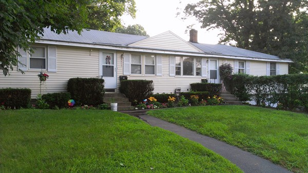 67 Rhodes Circle Hingham, MA 02043 - Photo 1 of 12 a view of a house with backyard sitting area and garden