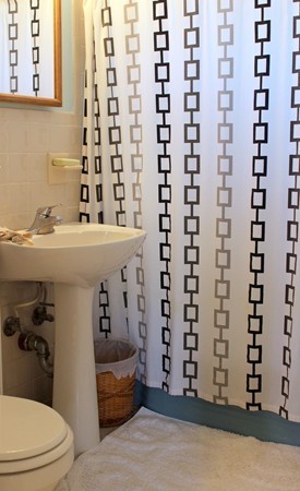 67 Rhodes Circle Hingham, MA 02043 - Photo 12 of 12 a bathroom with a sink and a mirror