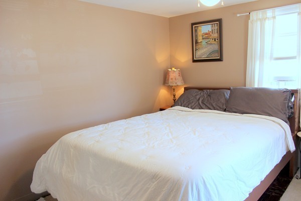 67 Rhodes Circle Hingham, MA 02043 - Photo 9 of 12 a bedroom with a bed and a window