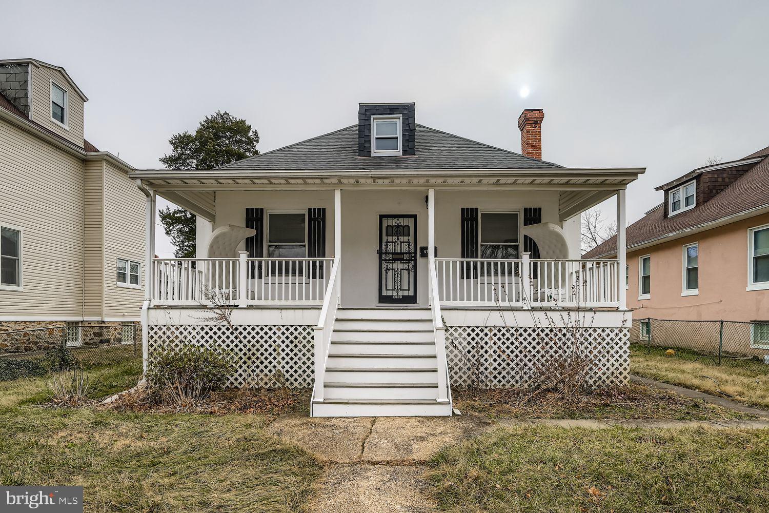 4111 Penhurst Avenue Baltimore, MD 21215 - Photo 1 of 39 a front view of a house with a garage