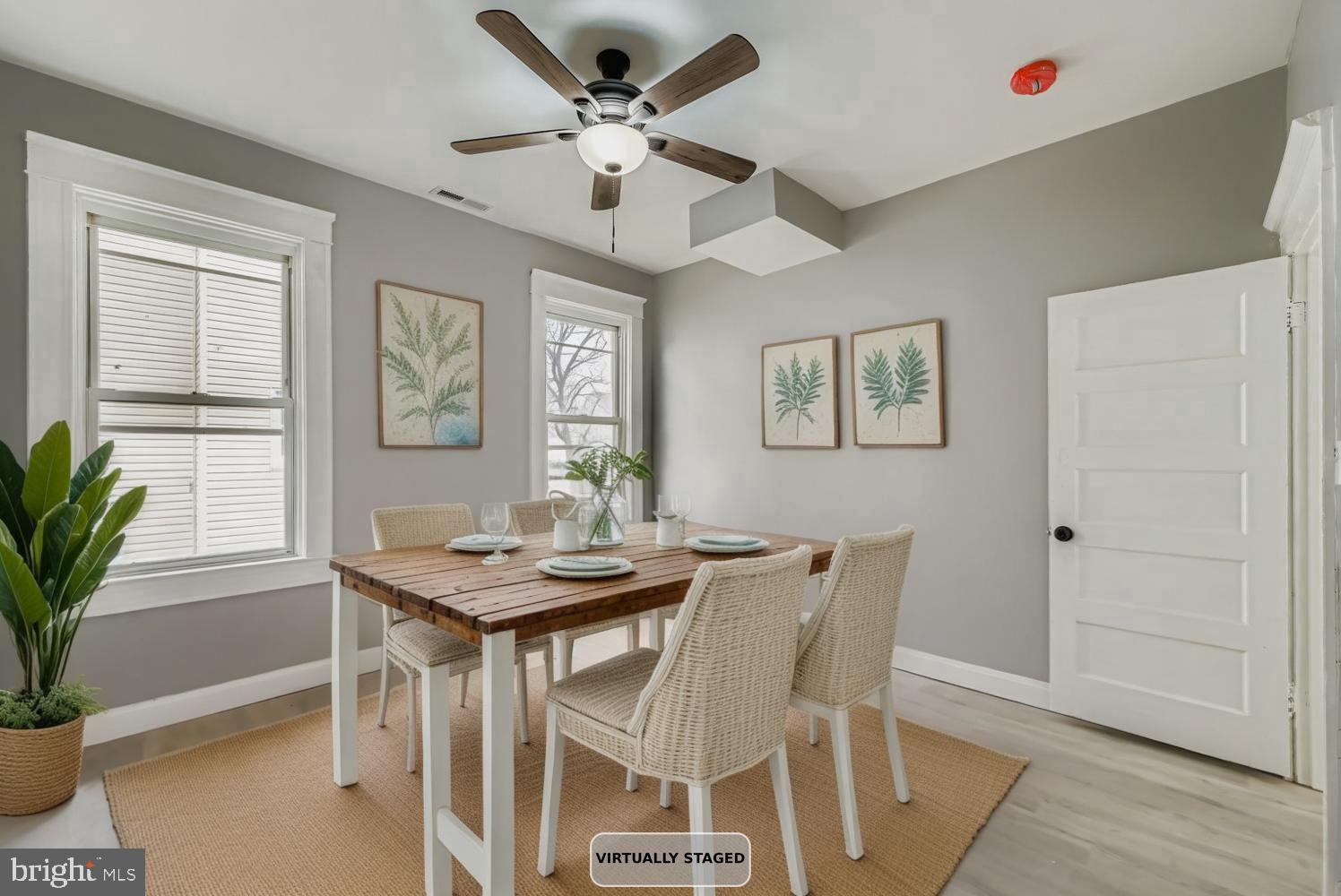 4111 Penhurst Avenue Baltimore, MD 21215 - Photo 11 of 39 a view of a dining room with furniture window and wooden floor