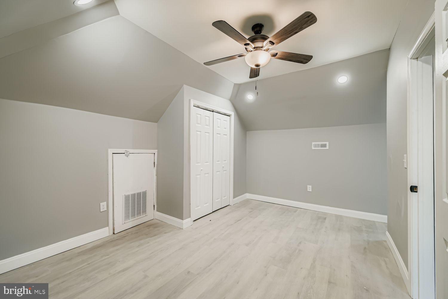 4111 Penhurst Avenue Baltimore, MD 21215 - Photo 21 of 39 an empty room with wooden floor and fan