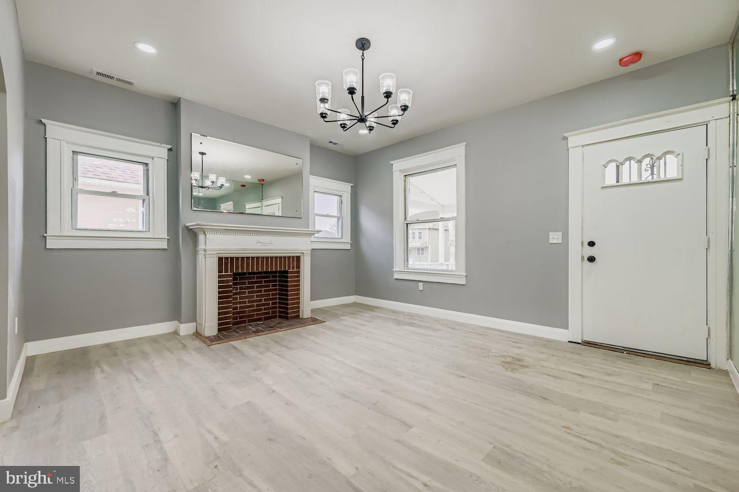 4111 Penhurst Avenue Baltimore, MD 21215 - Photo 5 of 39 a view of an empty room with a fireplace