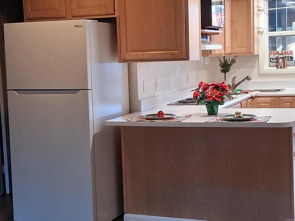 28857 Old Highway 80, Unit 14 Pine Valley, CA 91962 - Photo 12 of 12 a kitchen with a refrigerator and a sink