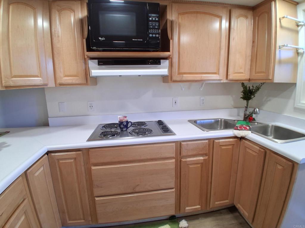 28857 Old Highway 80, Unit 14 Pine Valley, CA 91962 - Photo 2 of 12 a kitchen with a sink and cabinets