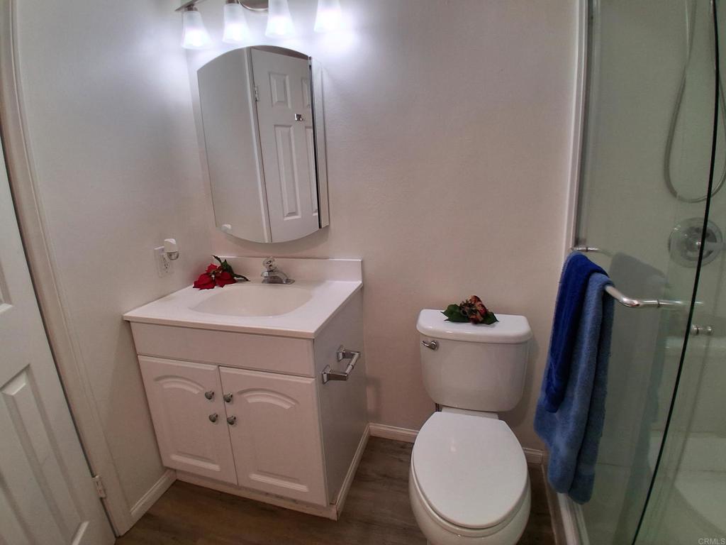 28857 Old Highway 80, Unit 14 Pine Valley, CA 91962 - Photo 3 of 12 a bathroom with a toilet sink and mirror