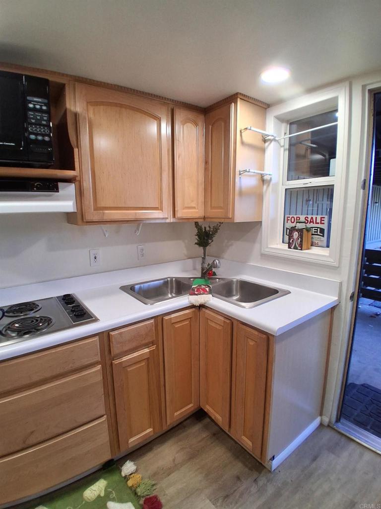 28857 Old Highway 80, Unit 14 Pine Valley, CA 91962 - Photo 10 of 12 a kitchen with a sink cabinets and window