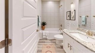 1791 Roberts Trail Bell, FL 32619 - Photo 19 of 28 a bathroom with a granite countertop sink toilet and shower