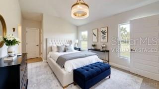 1791 Roberts Trail Bell, FL 32619 - Photo 22 of 28 a spacious bedroom with a bed and window