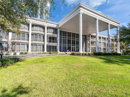 a front view of a house with a yard balcony