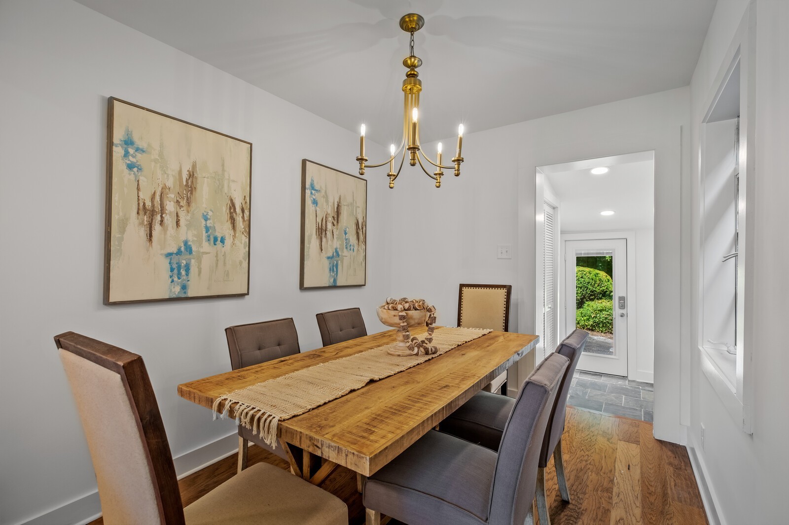 4911 Log Cabin Road Nashville, TN 37216 - Photo 6 of 10 a view of a dining room with furniture a chandelier and wooden floor