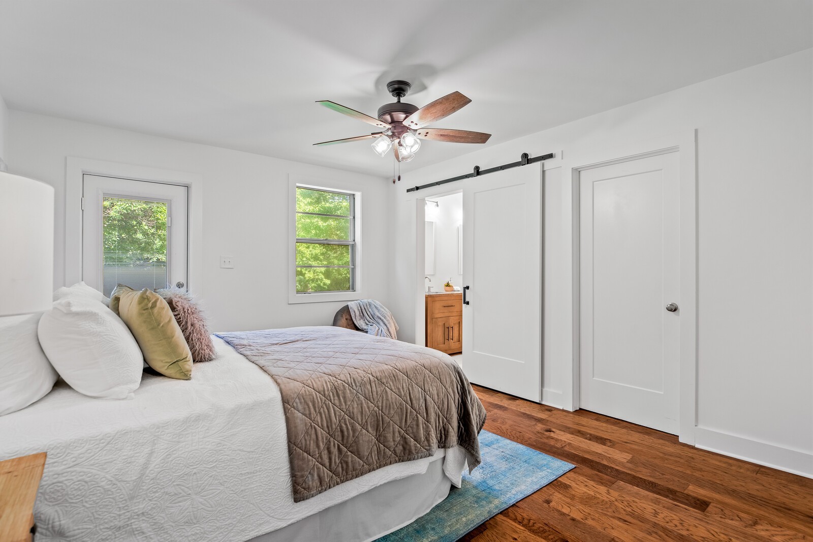 4911 Log Cabin Road Nashville, TN 37216 - Photo 8 of 10 a bedroom with a bed and wooden floor