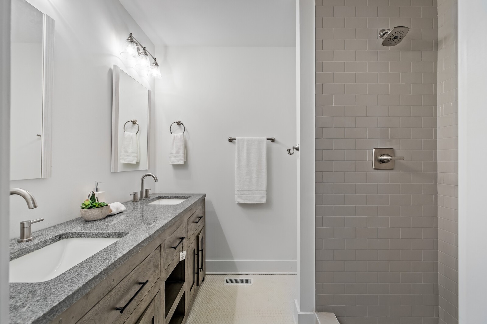 4911 Log Cabin Road Nashville, TN 37216 - Photo 9 of 10 a bathroom with double vanity and a granite counter tops