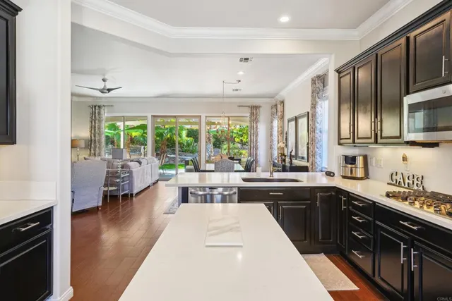 a kitchen with a refrigerator and cabinets