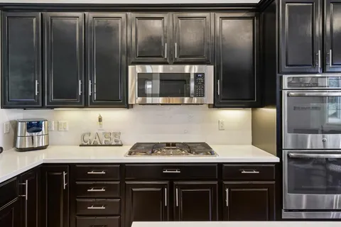 a kitchen with a stove and a sink