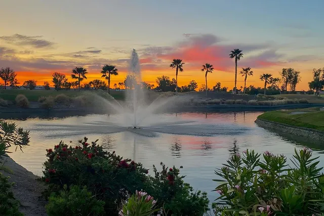 a view of a chairs and table in patio