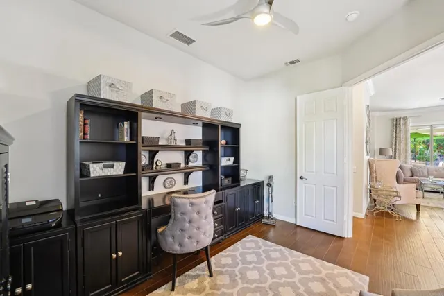 a view of a workspace with furniture
