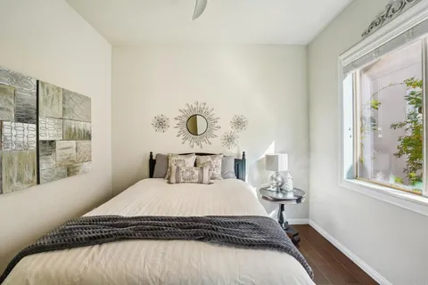 a bedroom with a bed and a window