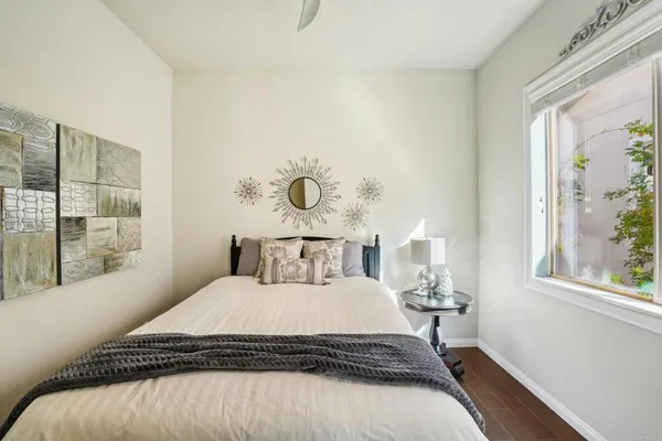 a bedroom with a bed and a window