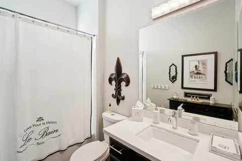 a bedroom with furniture and a large window