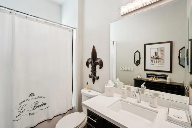 a bedroom with furniture and a large window