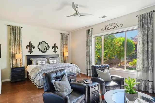 a bedroom with a bed and a couch