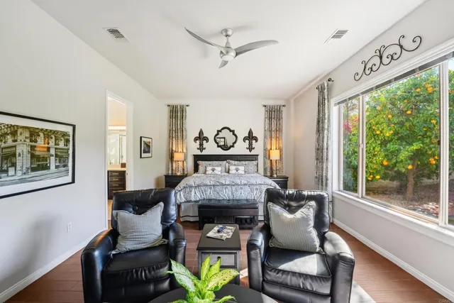 a work room with furniture and wooden floor