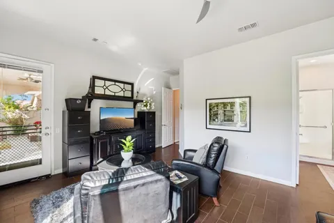 a bathroom with a tub sink double vanity and mirror