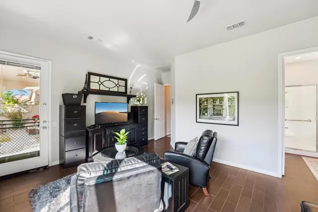 a bathroom with a tub sink double vanity and mirror