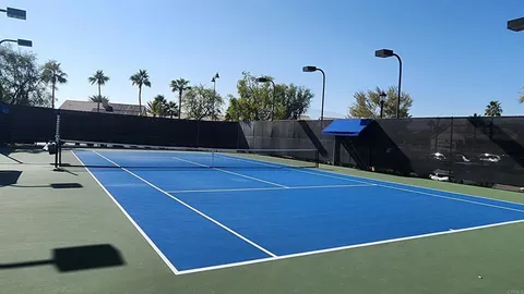 a living room with fireplace furniture and a large window