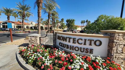 a view of a two chairs in the patio