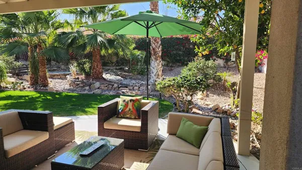 a front view of a house with porch and mountain view