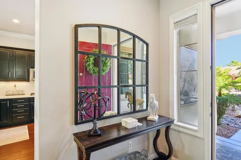 a view of a living room kitchen and a wooden floor