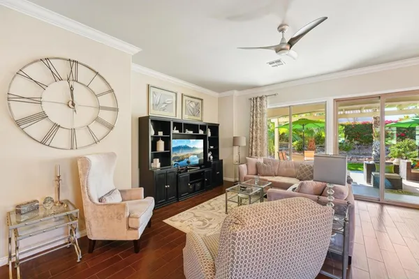 a living room with fireplace furniture and a wooden floor