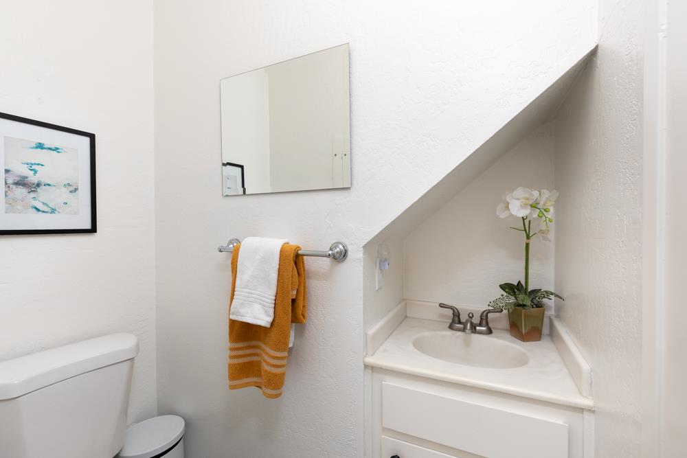 380 Sea Ridge Road, Unit E Aptos, CA 95003 - Photo 18 of 27 a bathroom with a sink and a mirror